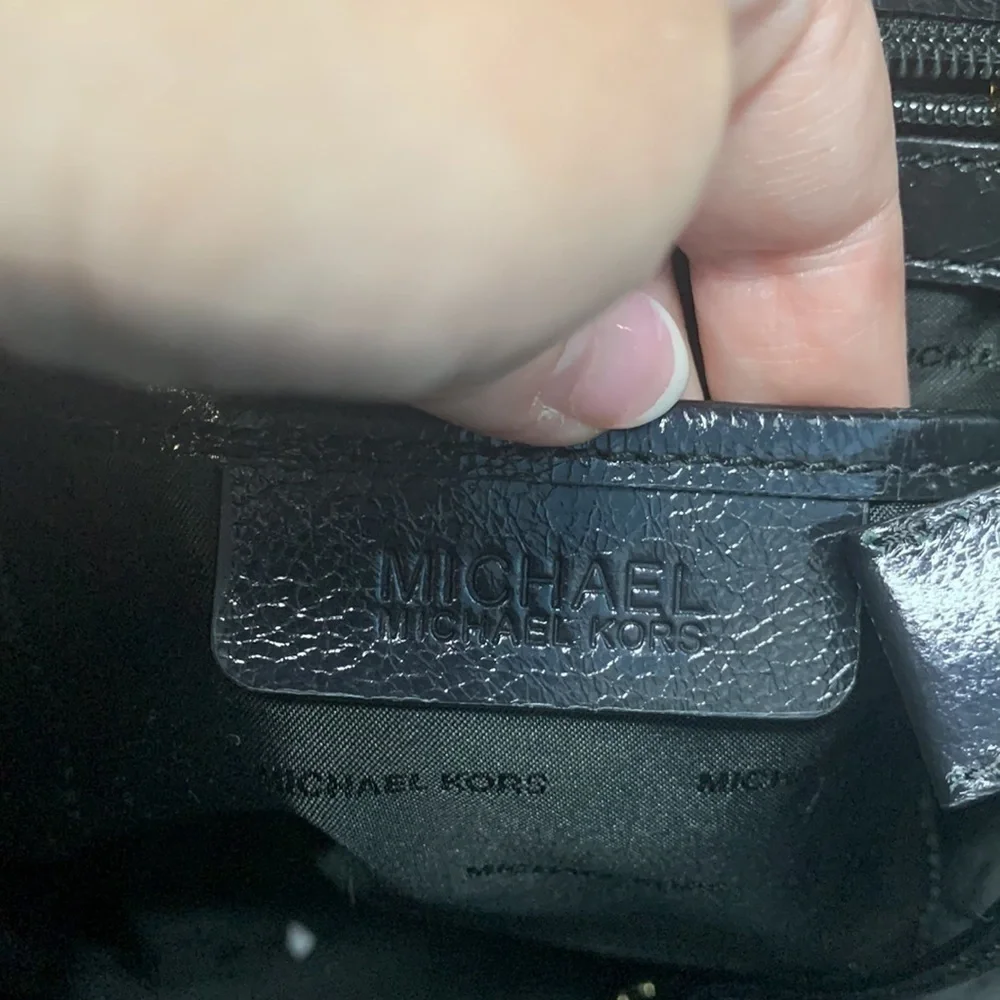 Michael Kors a black Vertical Tote.